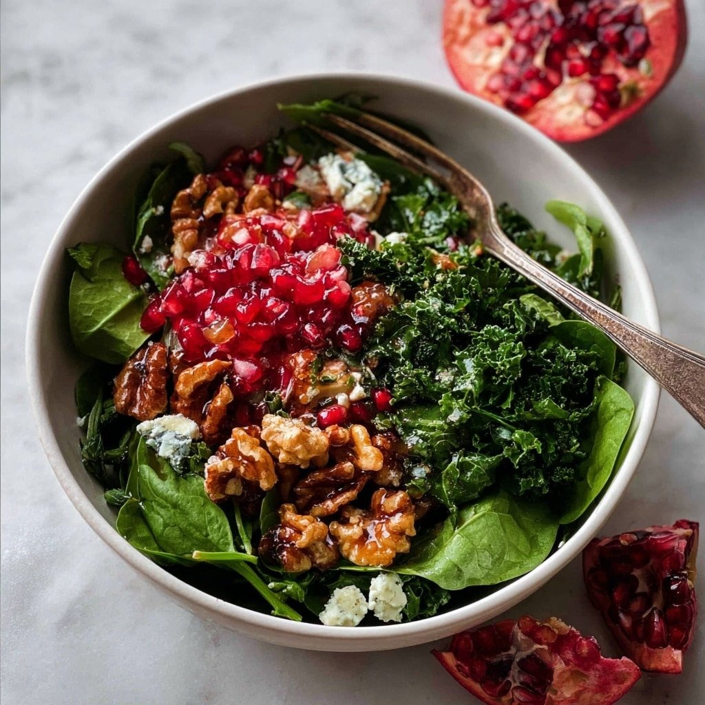 Pomegranate Salad with Marinated Kale, Blue Cheese, Honey Walnuts & Pomegranate Dressing Recipe - Recipe Image